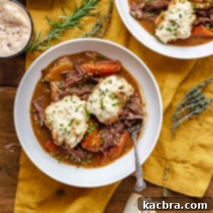 Bowls of beef stew with dumplings and a glass of Guinness.