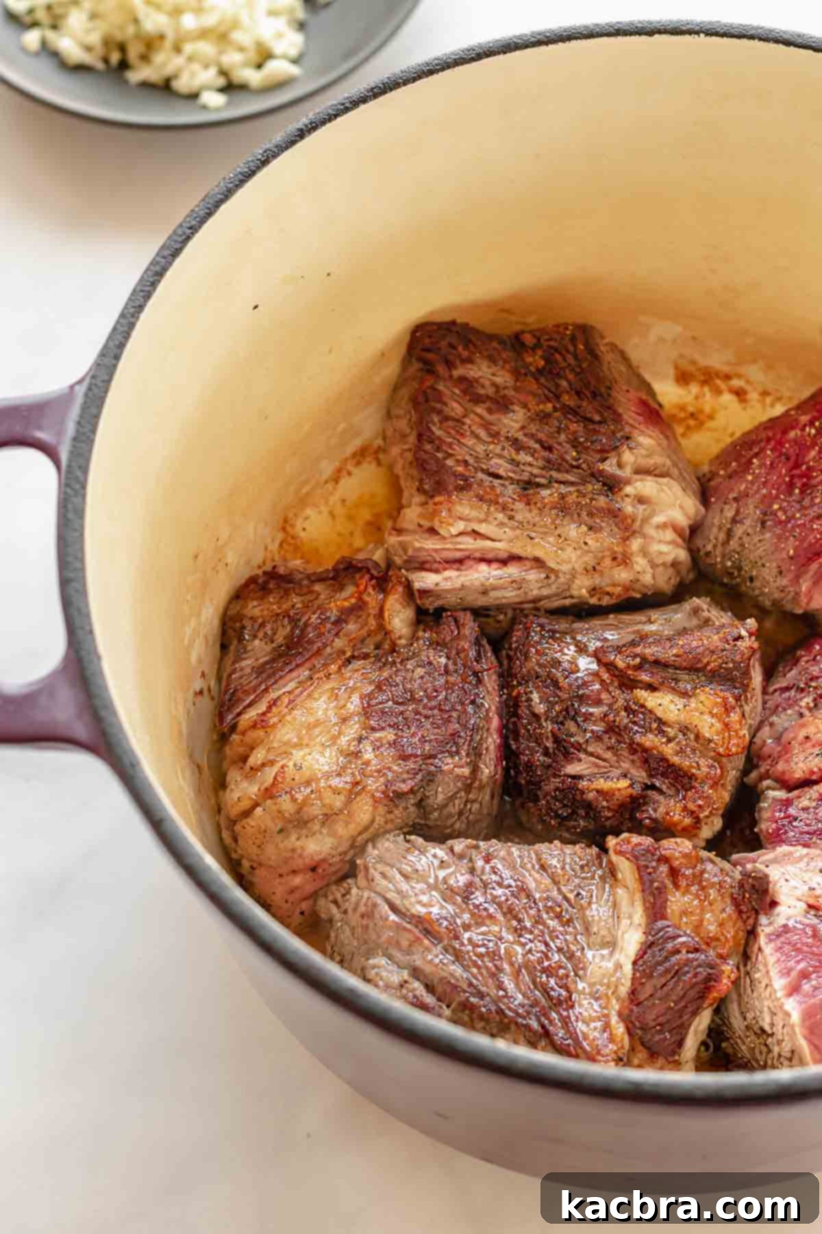 Chuck roast browning in a pot.