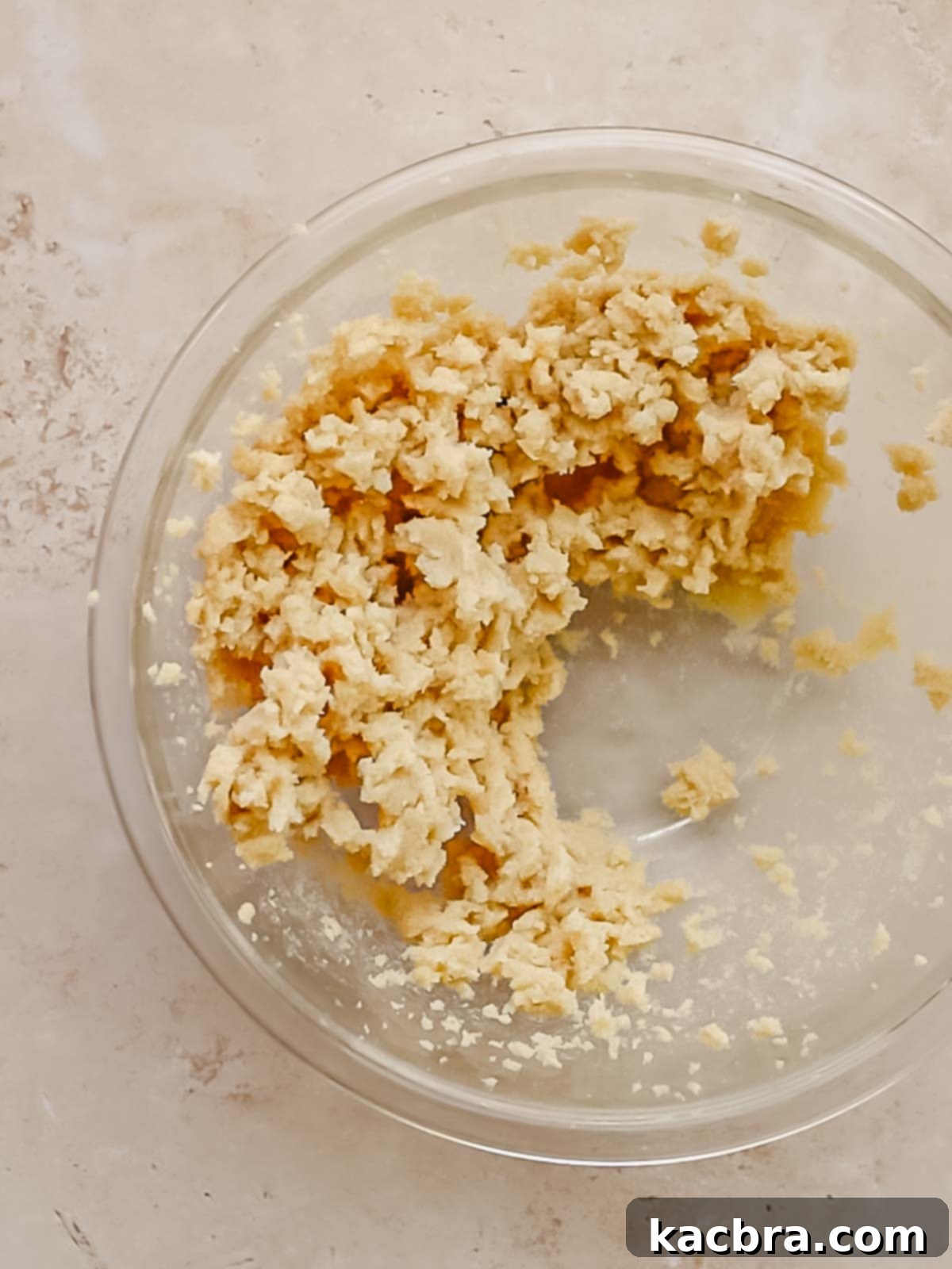 Butter and sugar creamed in a bowl.