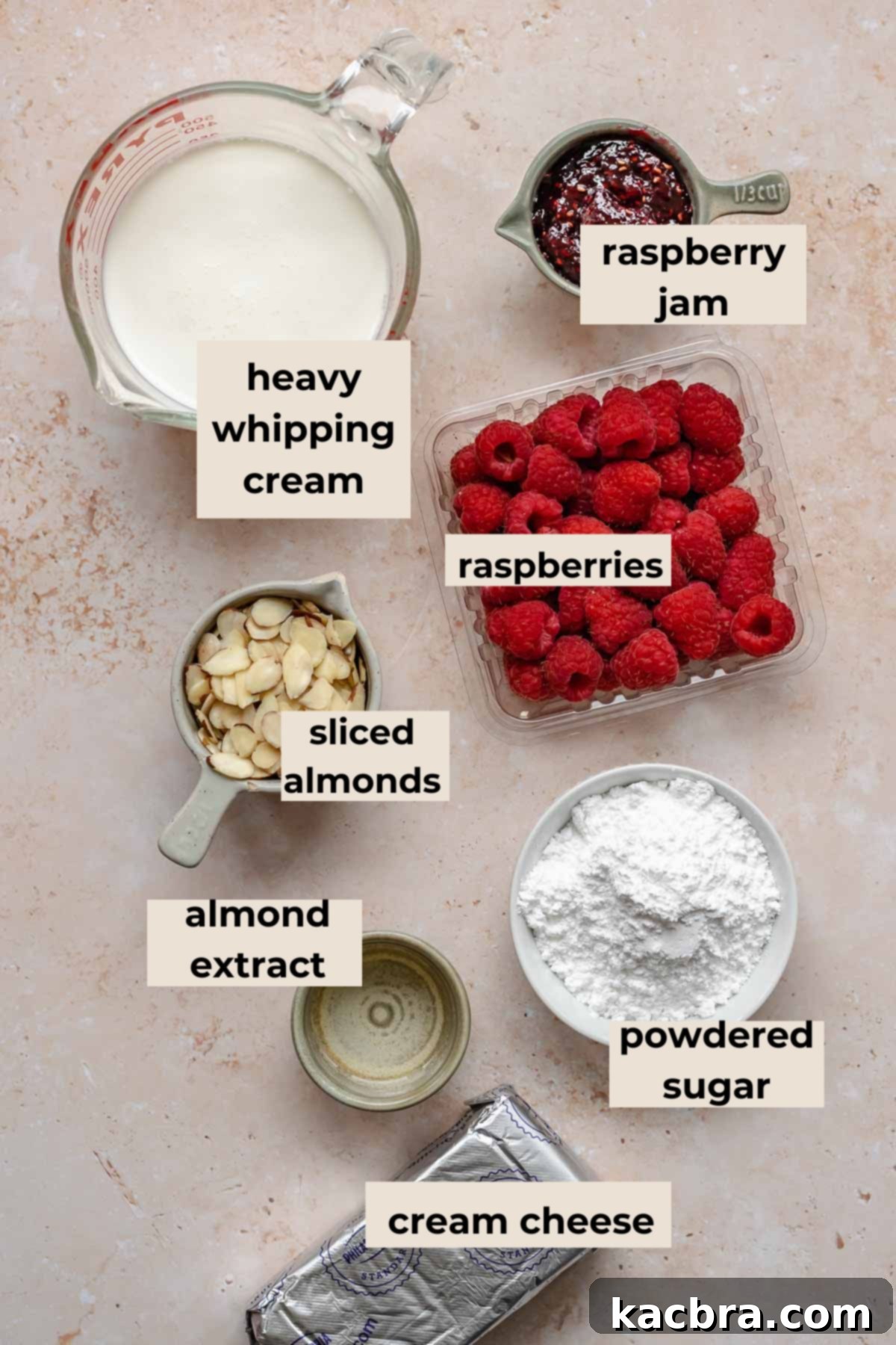 Crimson Kissed Almond Delight 4 Ingredients for the raspberry filling and cream cheese frosting, including cream cheese, heavy cream, raspberry jam, and fresh raspberries.