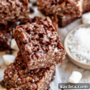 Chocolate Rice Krispie treats stacked on each other, looking delicious.