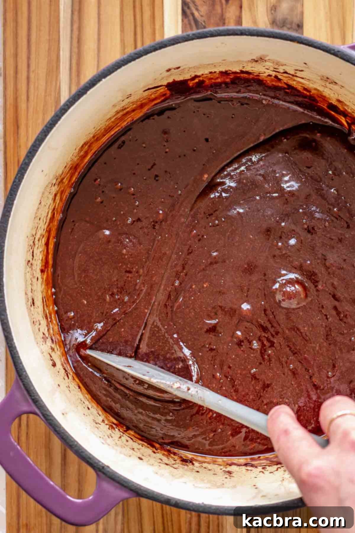 Smooth, melted chocolate and marshmallow mixture in a pot, ready for the next step.