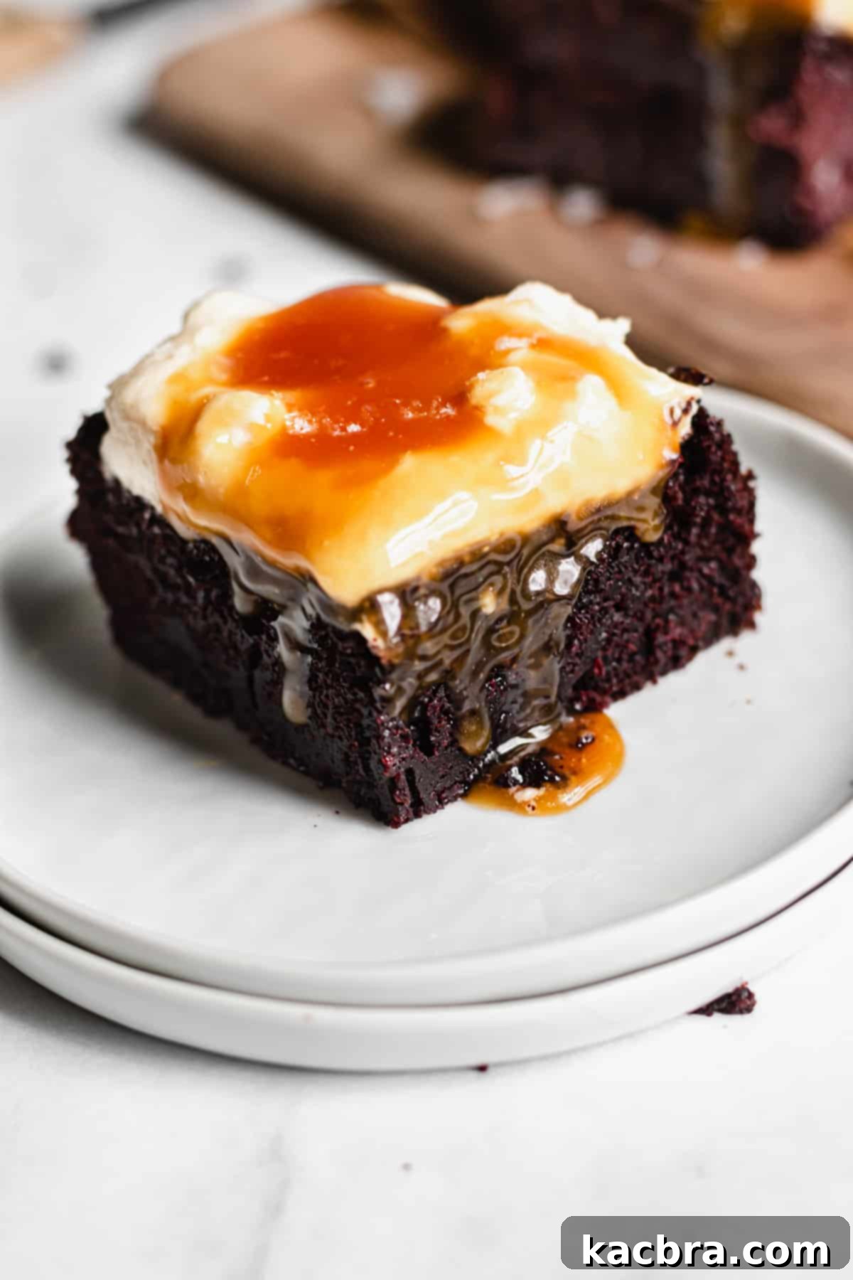 Salted Caramel Chocolate Indulgence 10 Slice of Chocolate Snack Cake with caramel dripping over the side