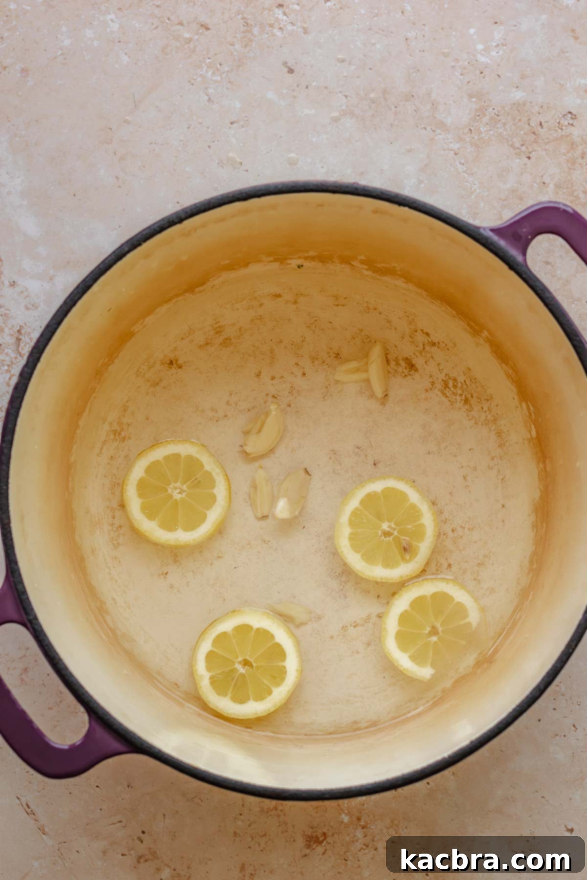 Lemon and garlic in water in a pot.