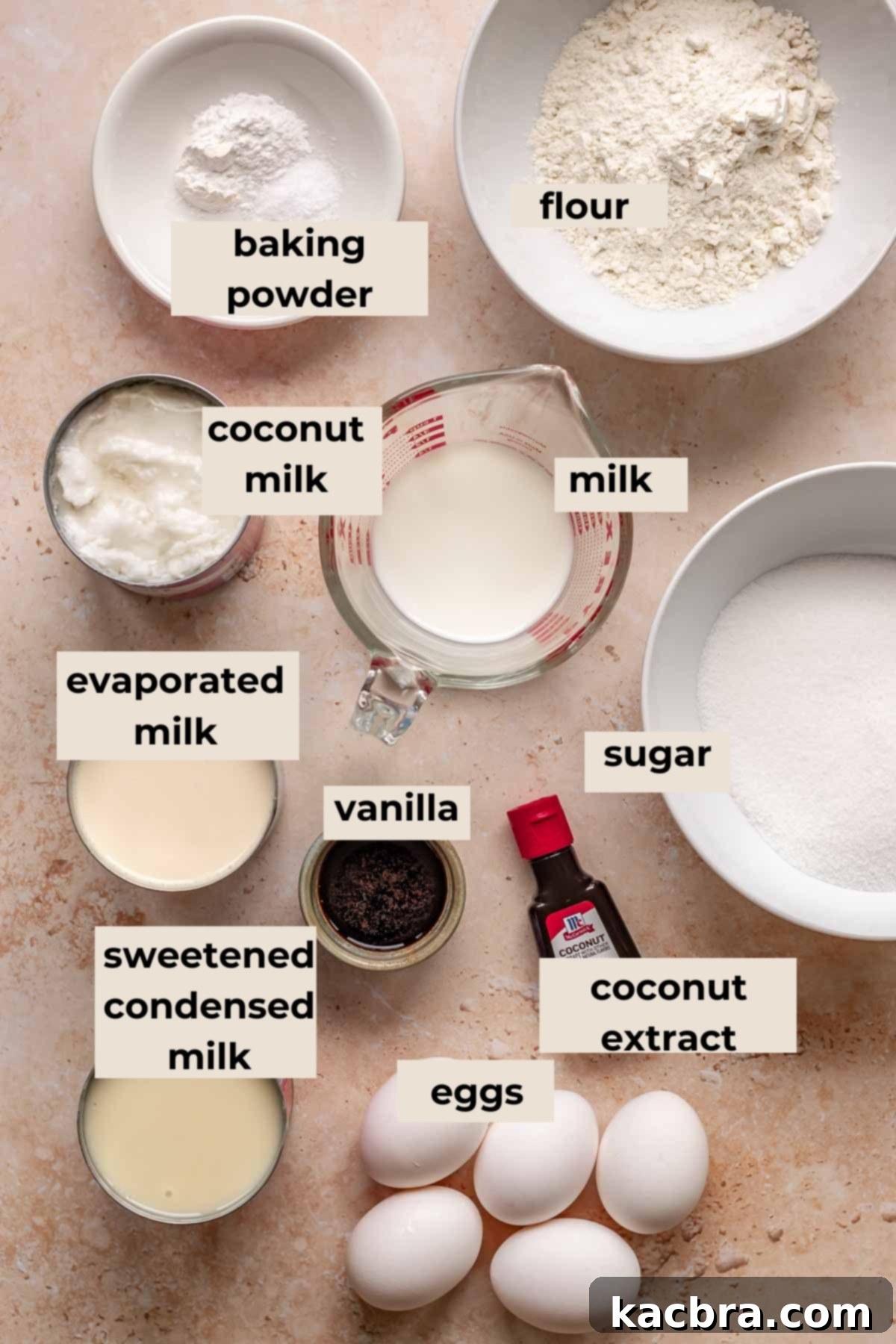 Tres leches cake ingredients, including eggs, flour, milks.
