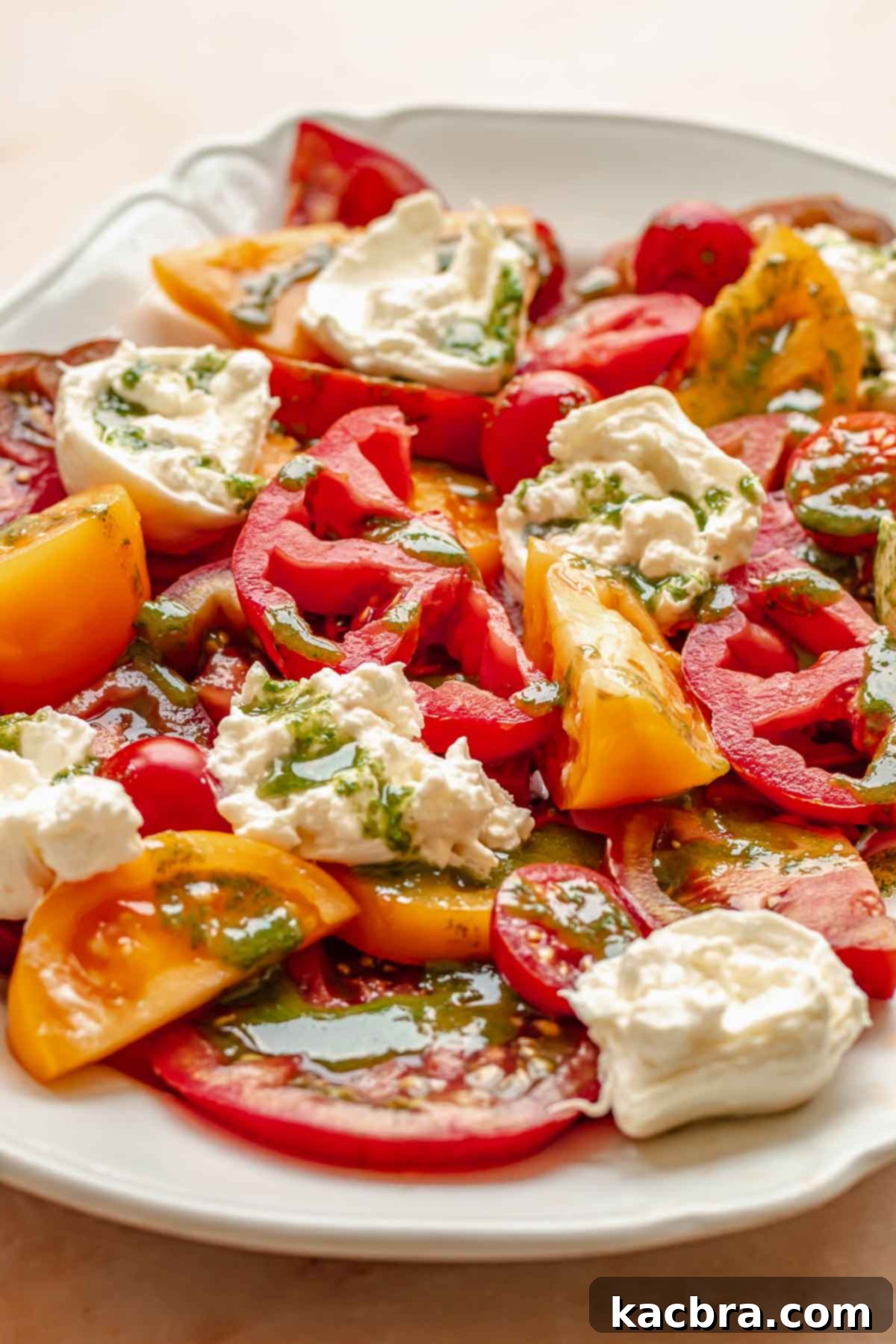 Fresh Burrata Caprese Drizzled with Aromatic Garlic Basil Oil 8 Garlic basil oil drizzled on caprese salad.