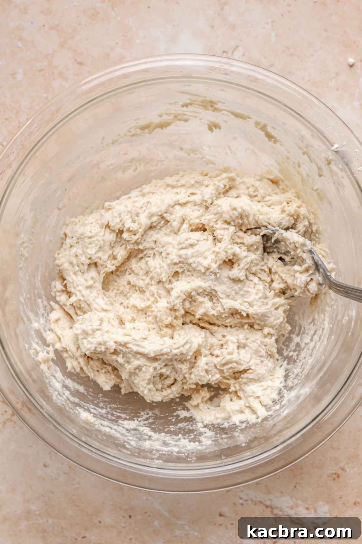 Golden Skillet Peach Cobbler 9 Biscuit topping in a bowl.