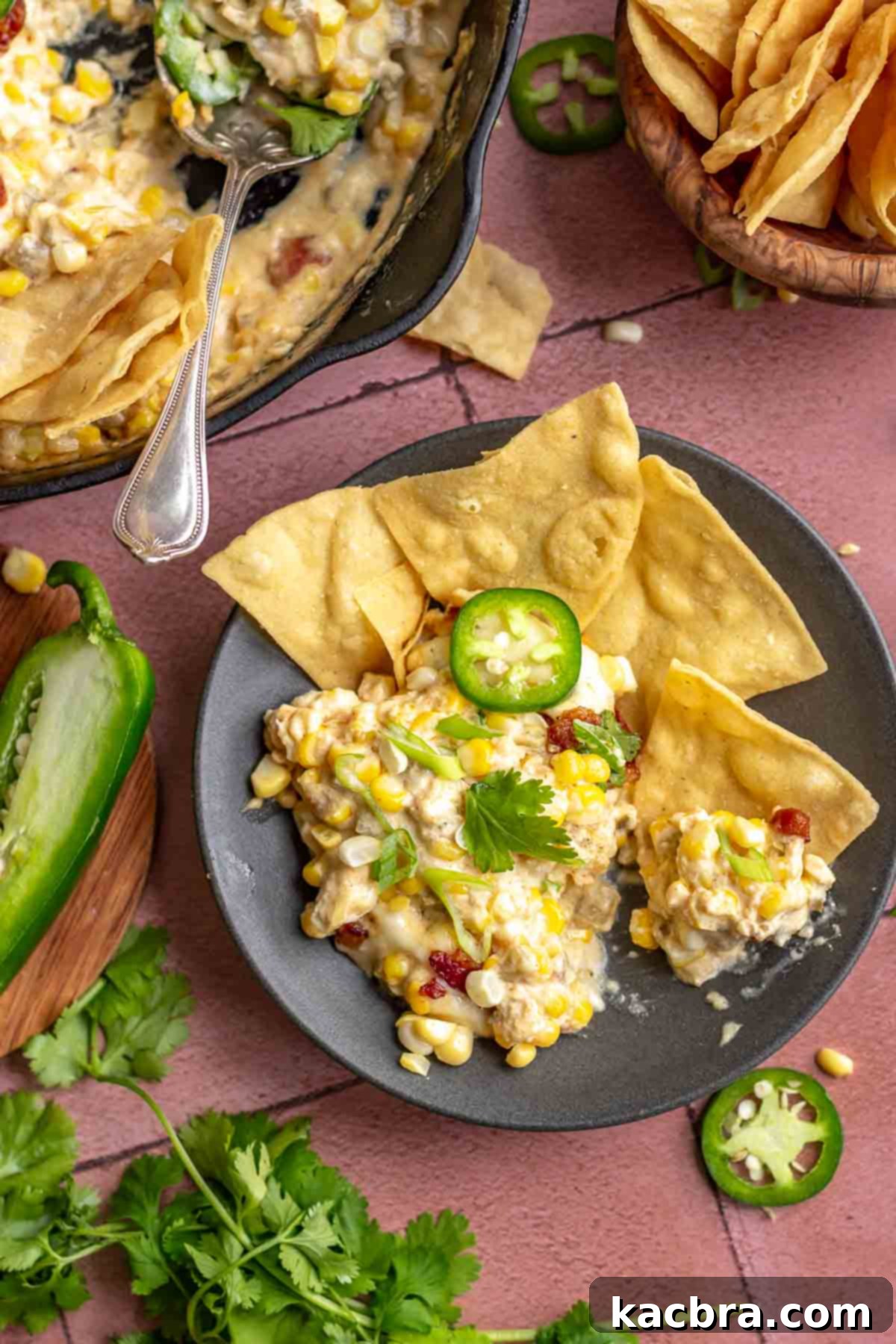 Kickin' Jalapeño Corn Dip 12 Corn dip in a small bowl with chips next to it.