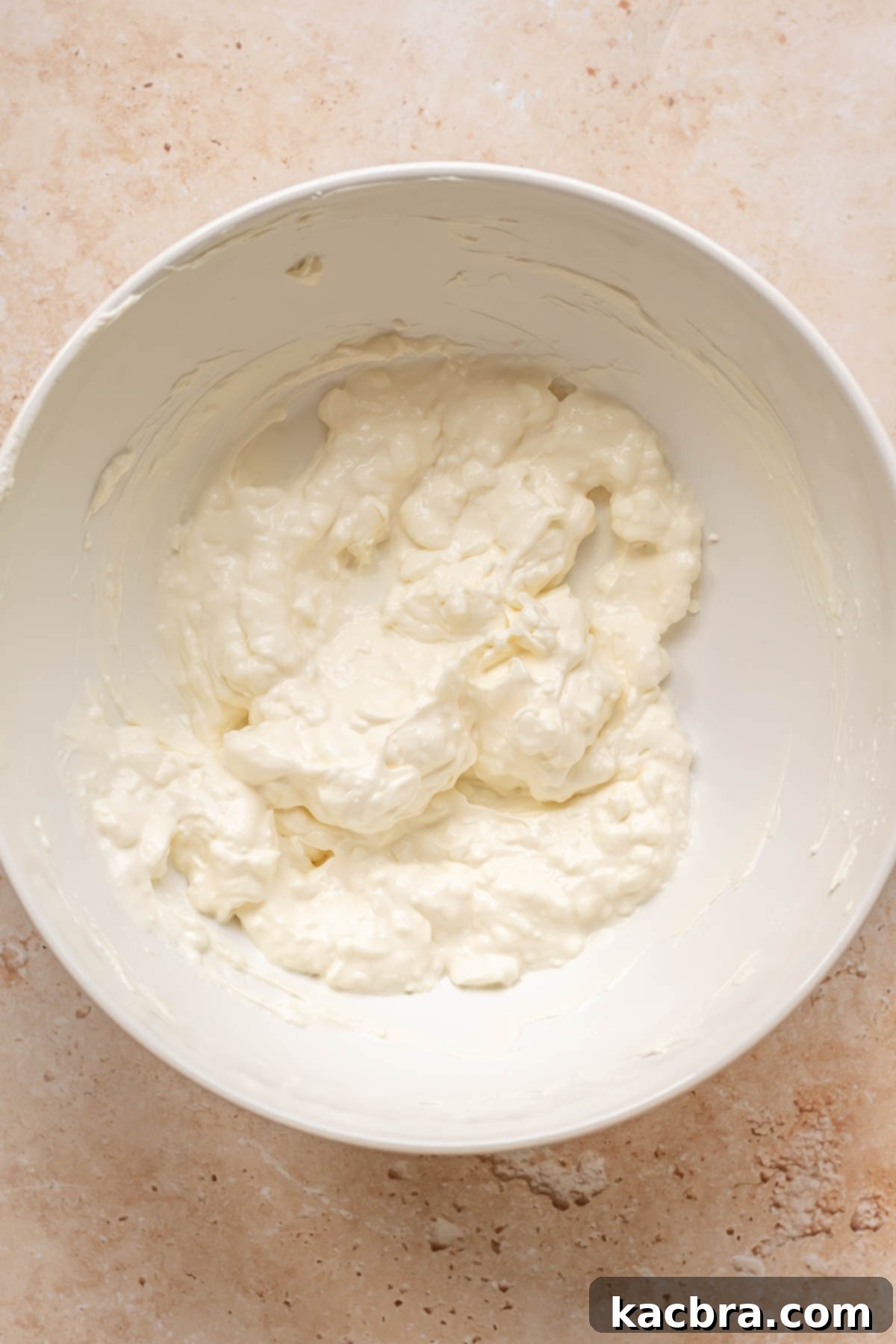 Kickin' Jalapeño Corn Dip 6 Cream cheese, mayonnaise and sour cream mixed in a bowl.