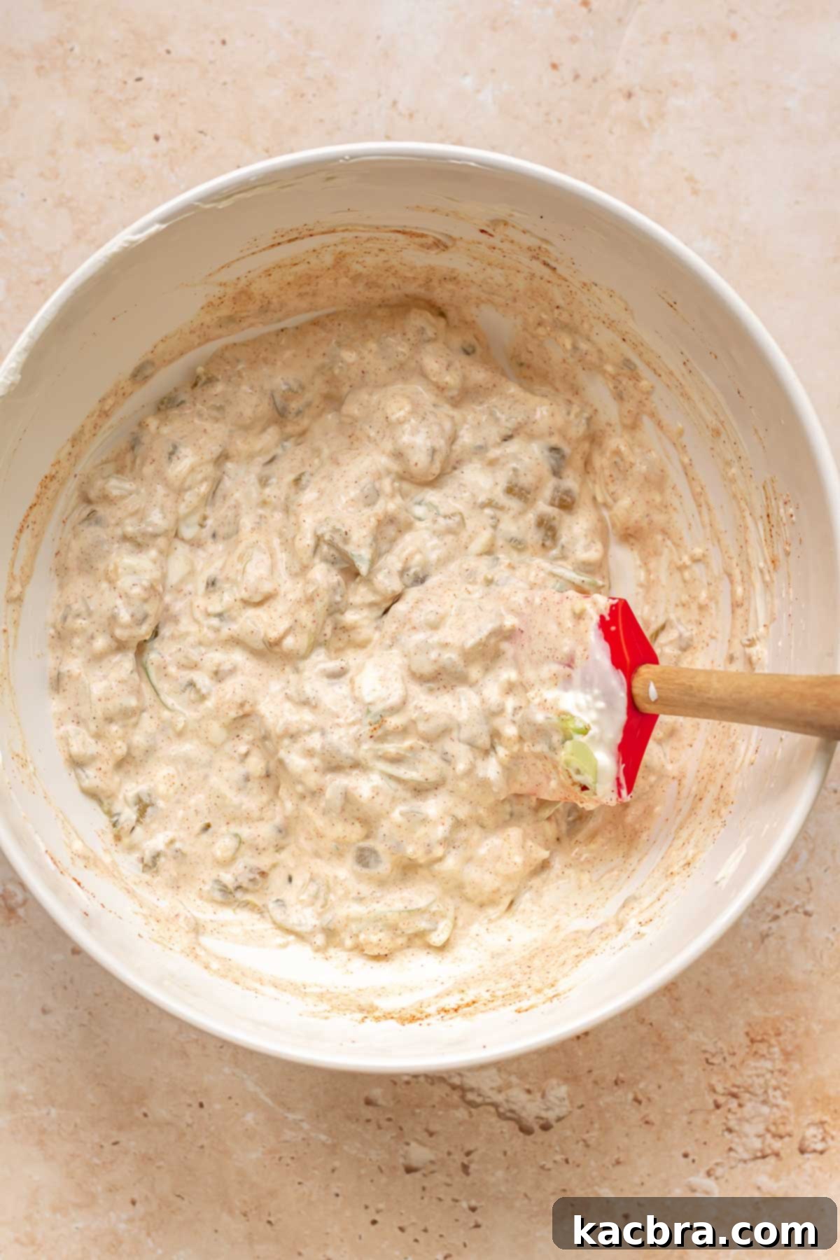 Kickin' Jalapeño Corn Dip 7 Spices and jalapeños mixed into the base in a bowl.