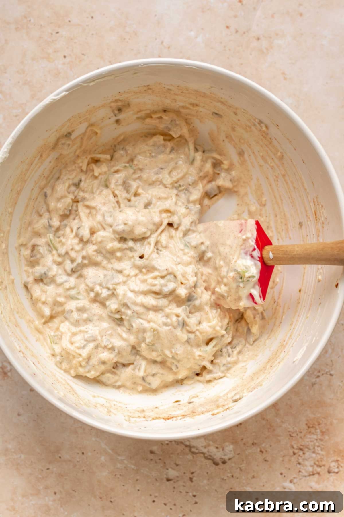 Kickin' Jalapeño Corn Dip 8 Cheese mixed into the base in a bowl.