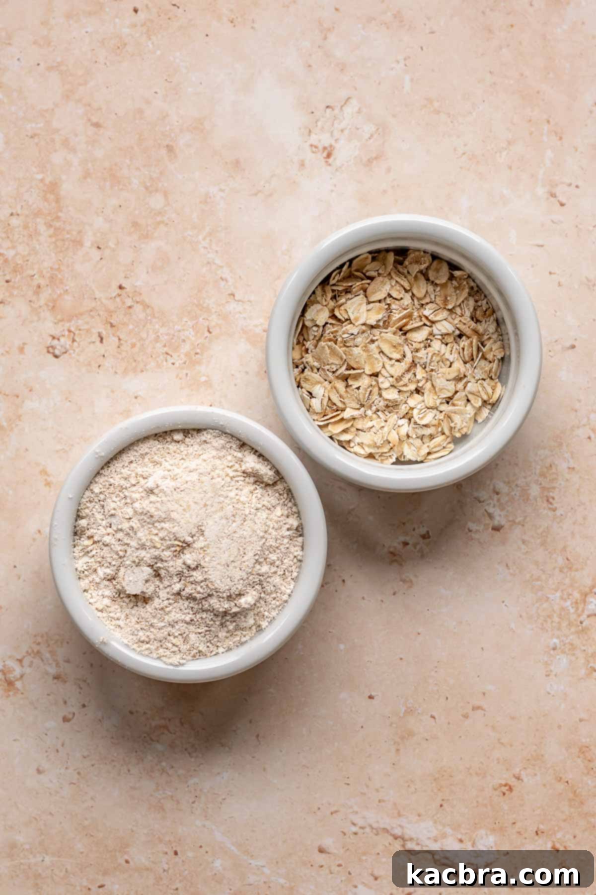 Sweet and Healthy Banana Blueberry Oatmeal Muffins 5 Two bowls, one with whole rolled oats and one with finely pulverized oats.