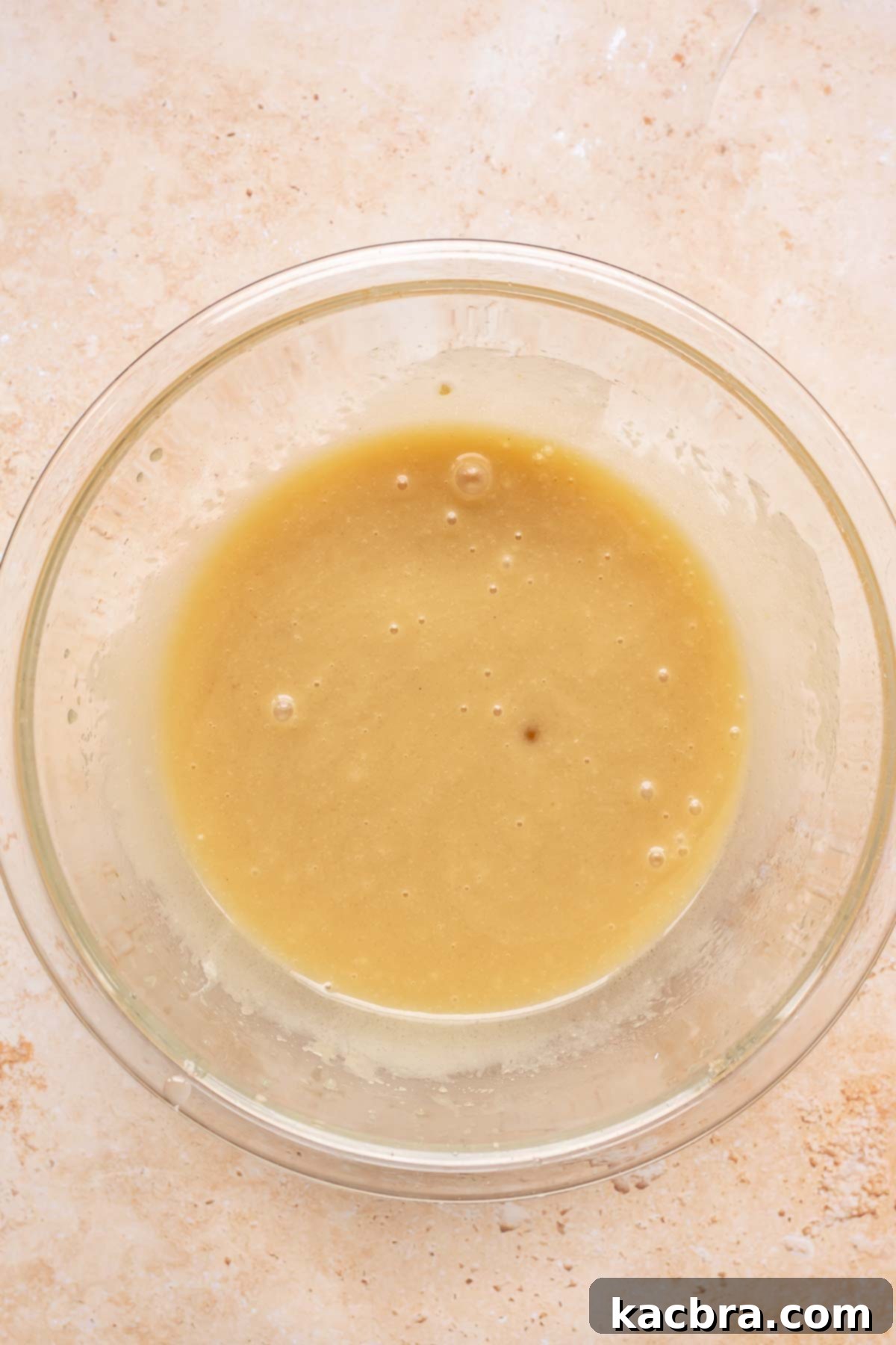 Sweet and Healthy Banana Blueberry Oatmeal Muffins 7 Wet ingredients whisked together in a bowl.