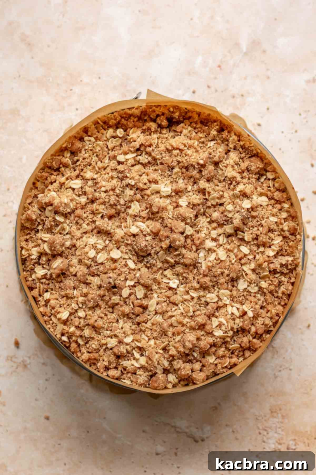 Crumble topping on top of cheesecake batter.