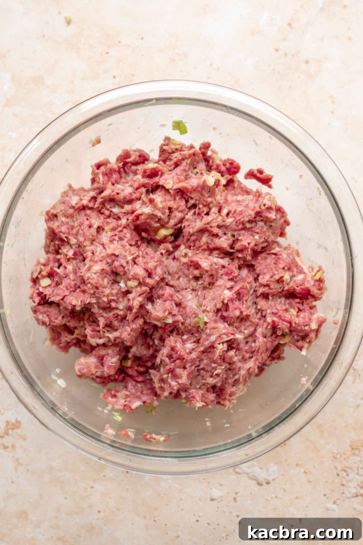 Mixed meatball meat in a bowl.