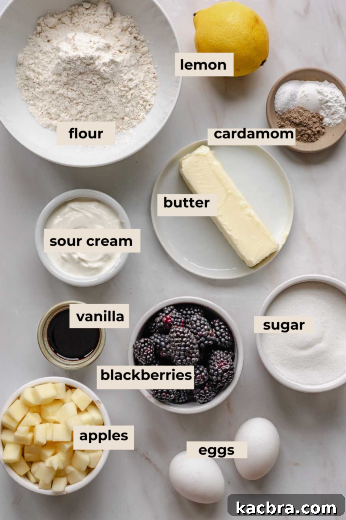 A beautiful flat lay of fresh ingredients for baking blackberry apple cake.