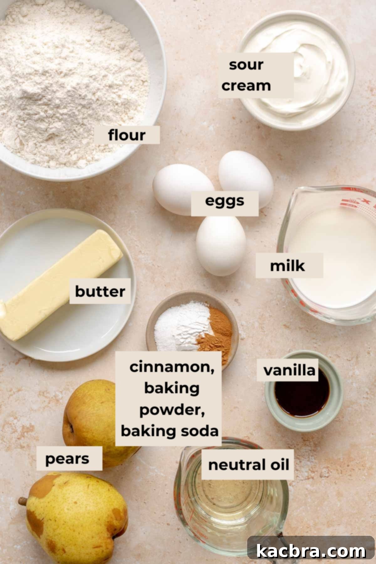 Key ingredients for pear muffins, such as flour, eggs, milk, sour cream, and pears.