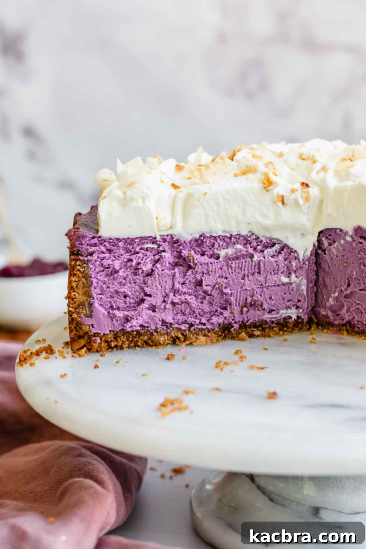 Use cheesecake sliced on a platter. A stunning purple slice awaits.