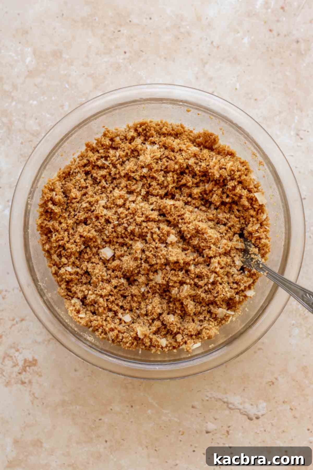 Graham cracker crust mixed together in a bowl.