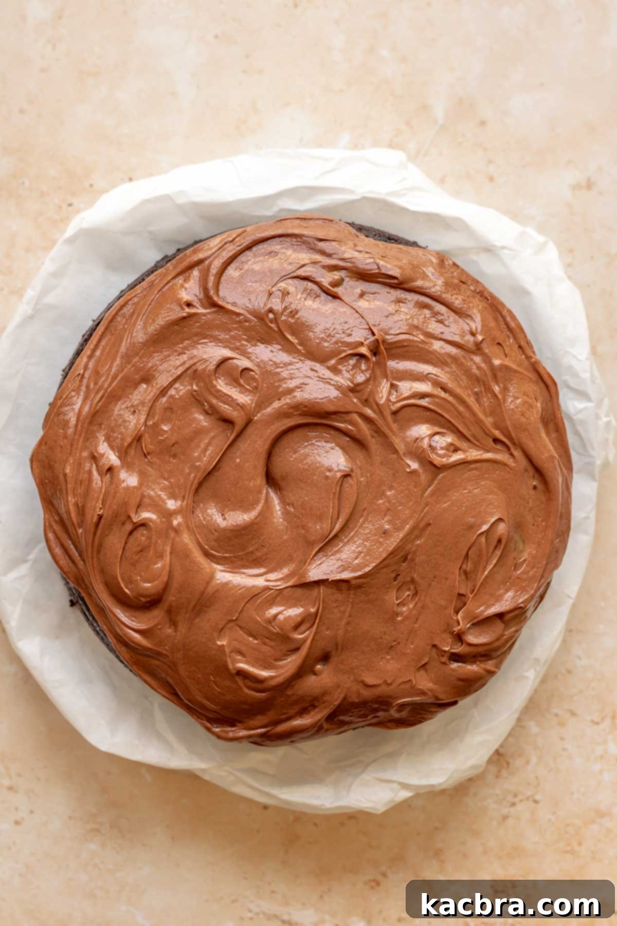 Decadent Chocolate Walnut Dream 18 The fully frosted chocolate walnut cake with rustic swoops and swirls on top for decoration, ready for final garnishes and serving.