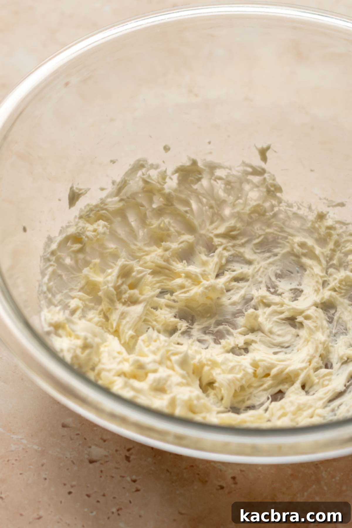Creamed butter and cream cheese in a bowl.