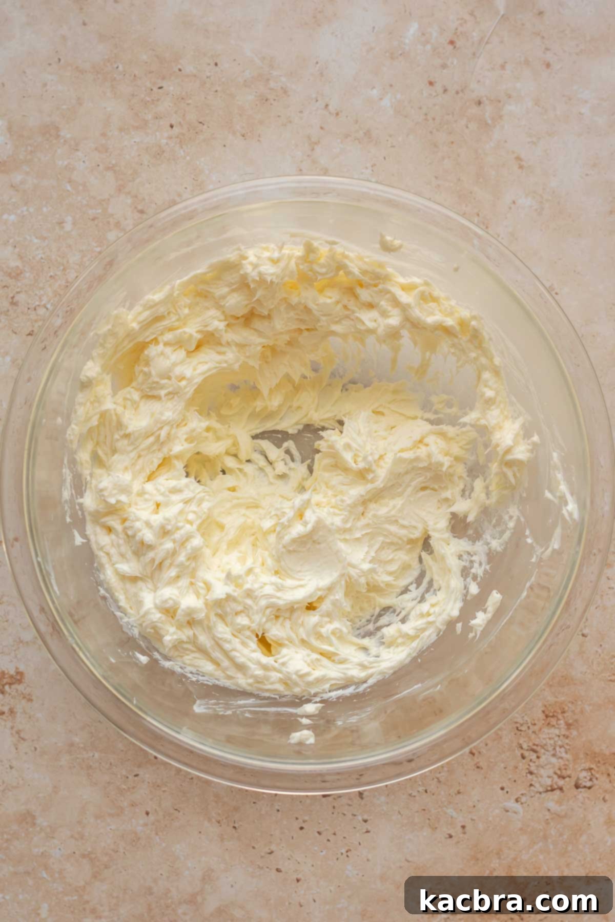 Creamed butter and cream cheese in a bowl.