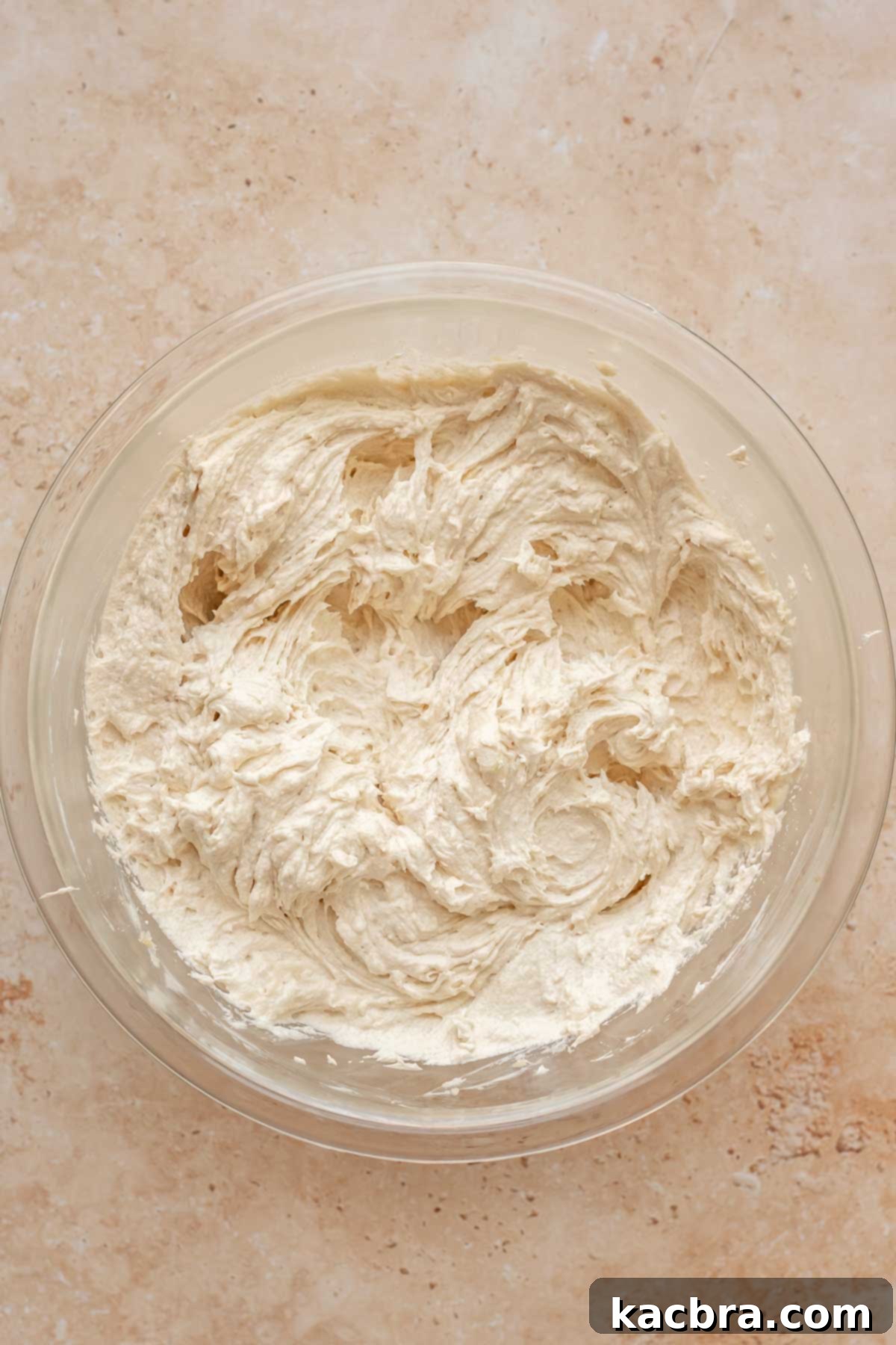 Creamed butter and sugar in a bowl.