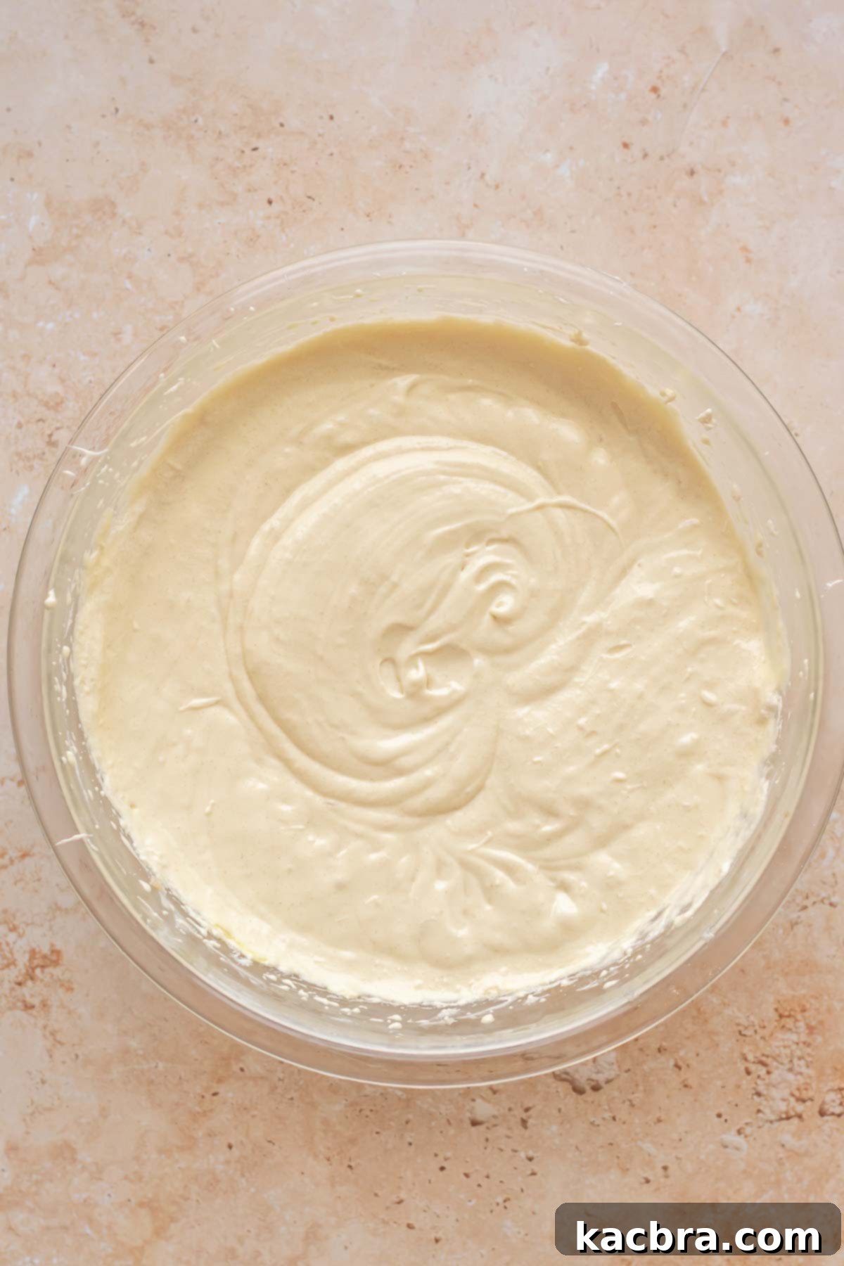 Vanilla cake batter in a bowl.