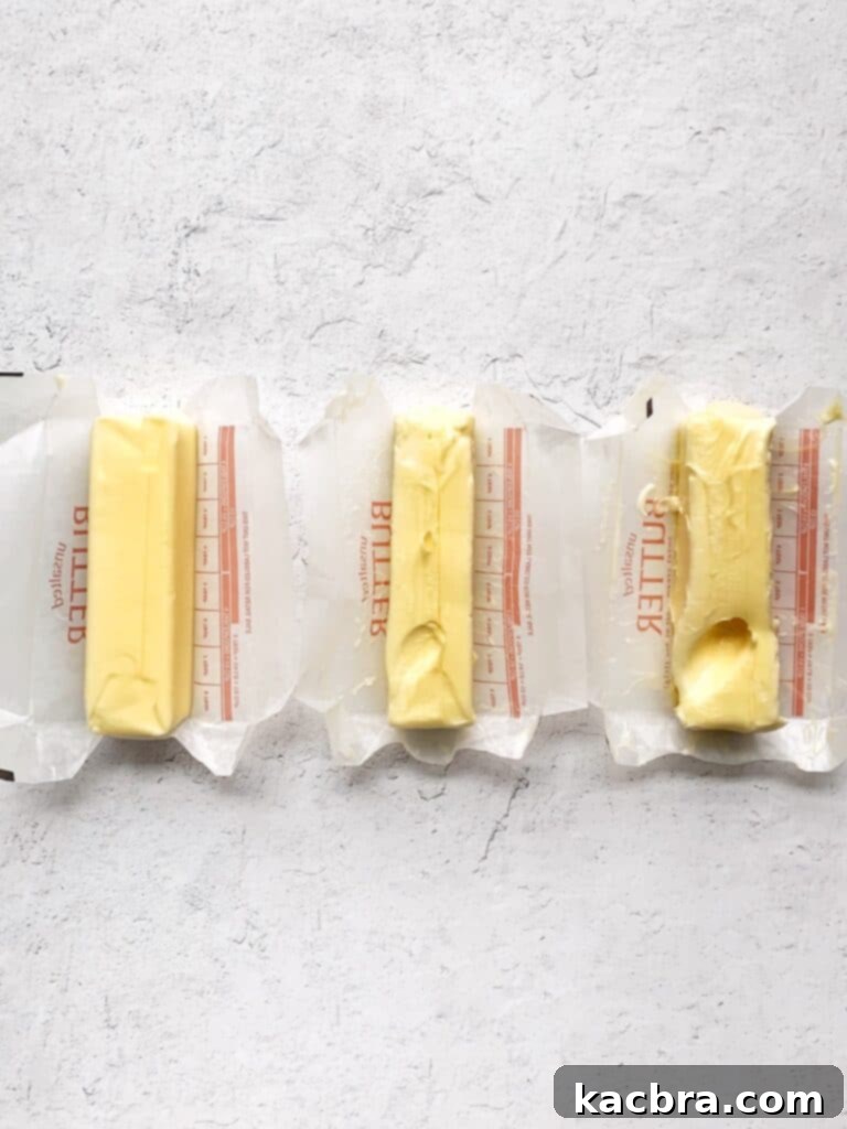 Decoding Room Temperature for Better Butter 2 Three sticks of butter next to each other. One is cold, one at room temperature, one too soft. Each stick of butter has a finger indent.