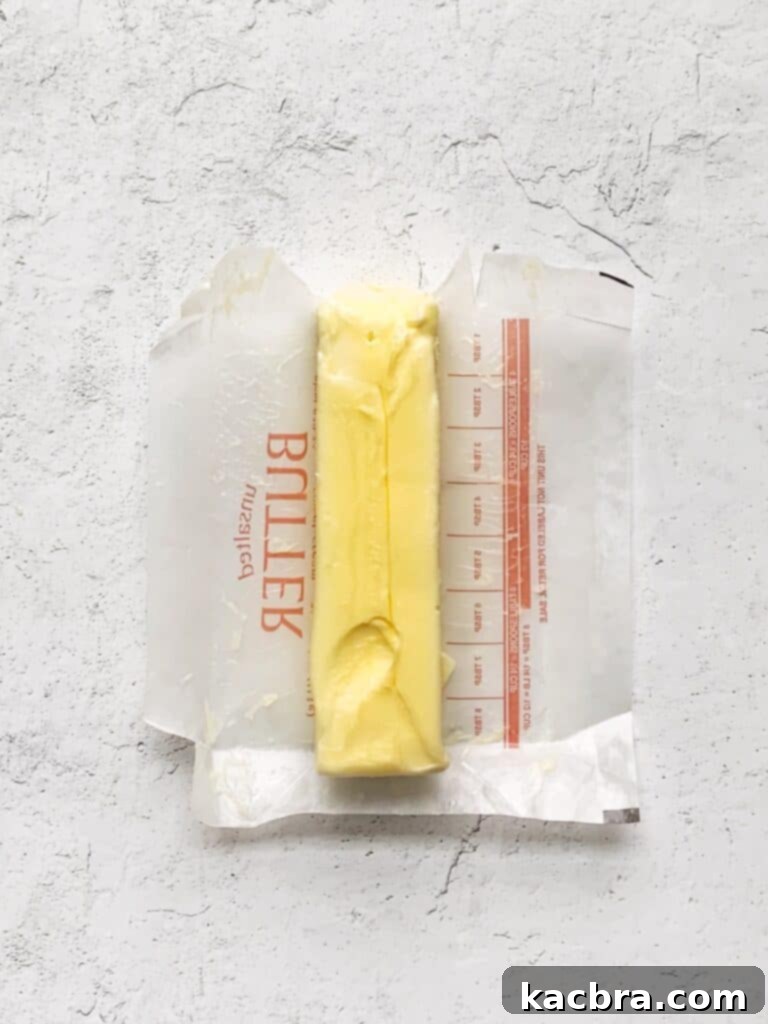 Decoding Room Temperature for Better Butter 5 Room temperature butter with a an indent from a finger showing how to know when it's the correct temperature