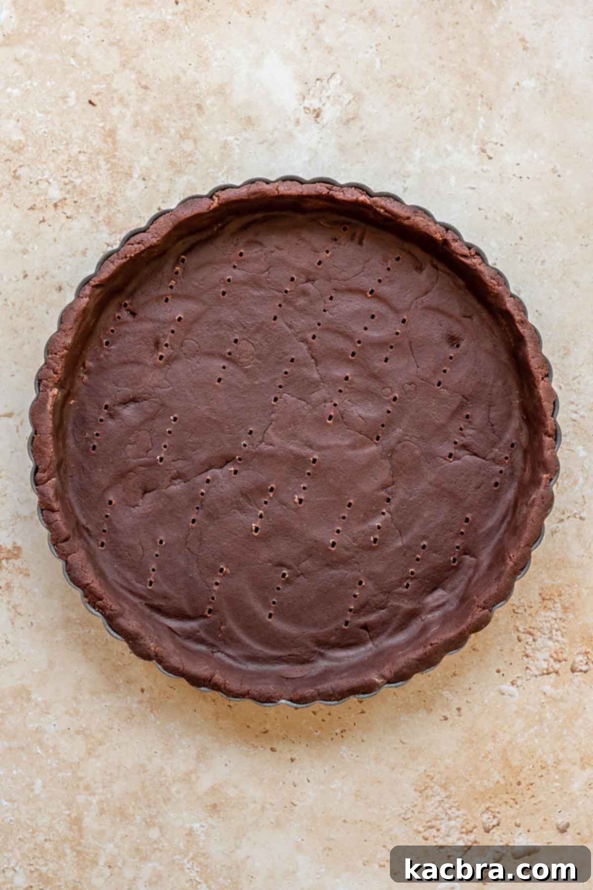 Decadent Chocolate Raspberry Delight 4 Chocolate sweet tart crust in a tart pan before baking.