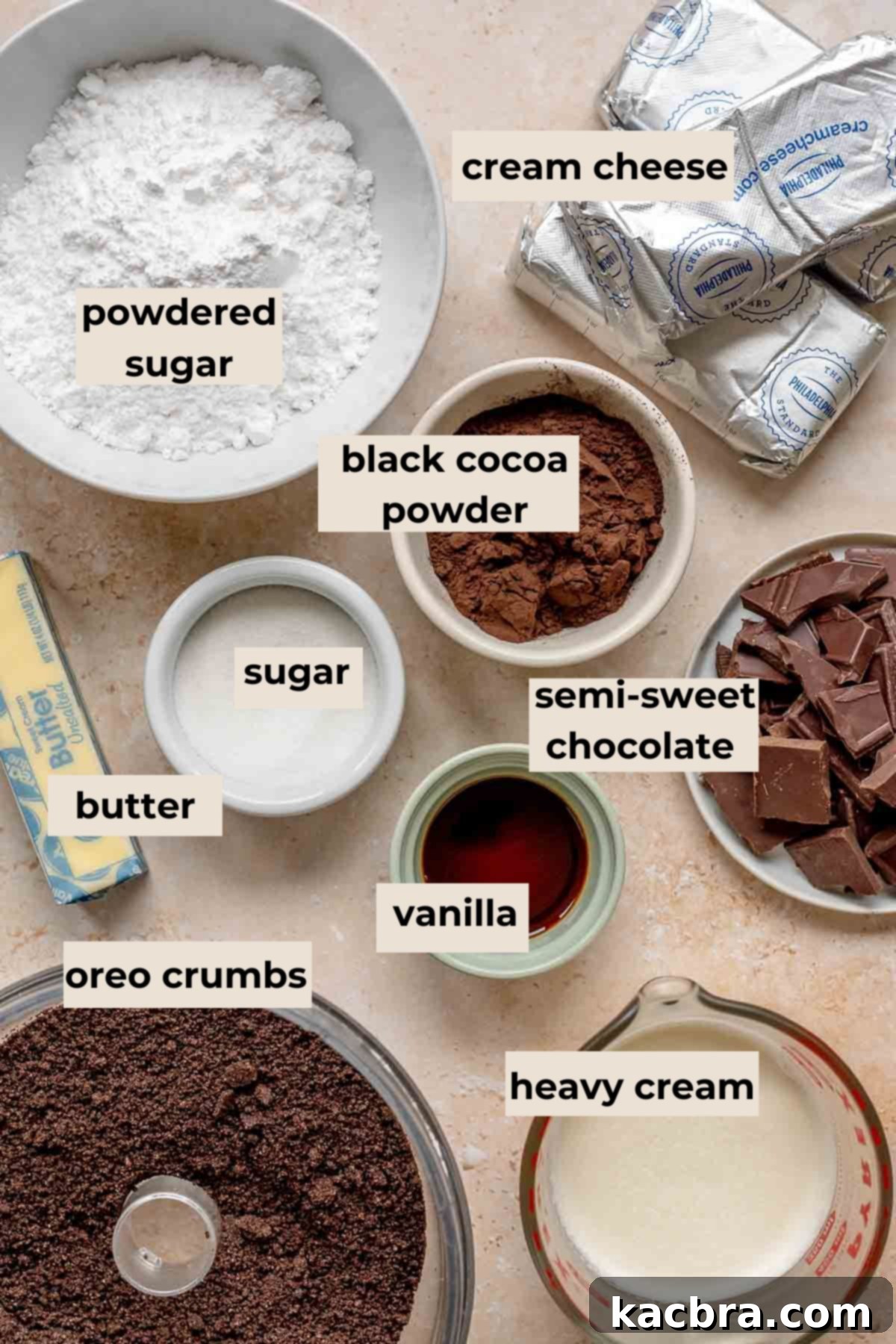 A flat lay photograph displaying all the ingredients required for making a Halloween cheesecake, neatly arranged on a rustic surface.