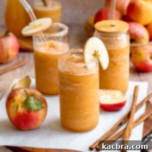 Spiced Apple Slush: Customize Your Cool 13 Apple cider slushie poured into glasses with straws and apple garnishes.