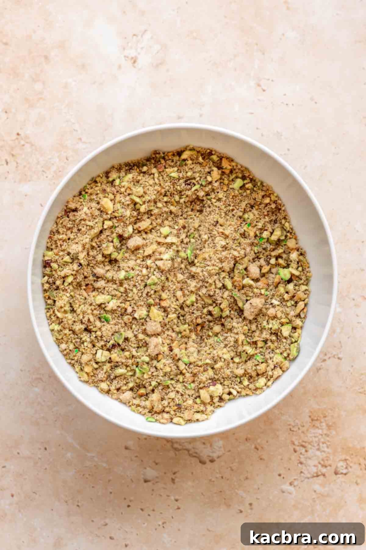 Golden Honey Baklava Dream Cake 5 Mixed nuts and brown sugar in a bowl, ready for the baklava layer.