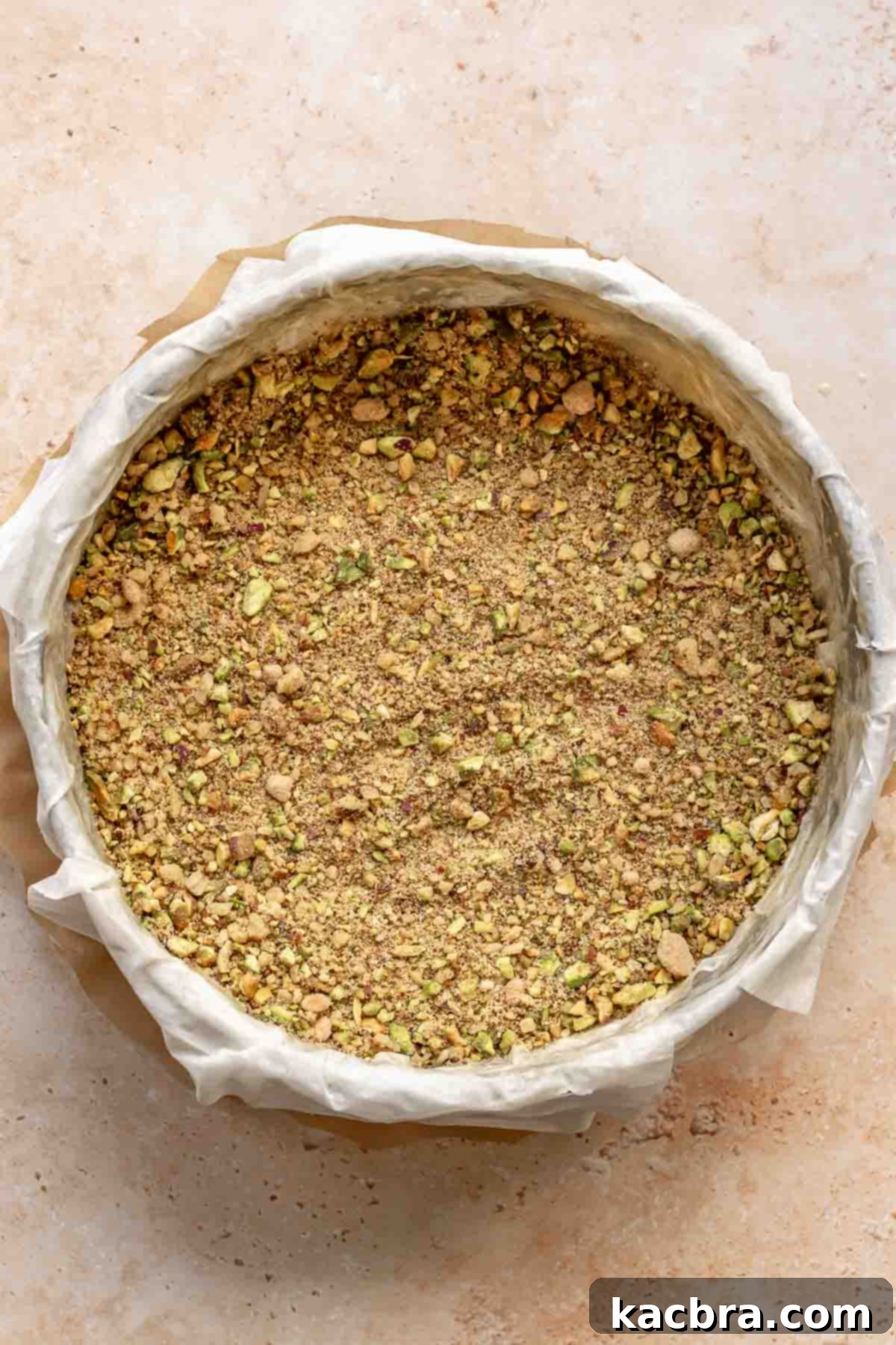 Golden Honey Baklava Dream Cake 7 Half of the nut and sugar mixture spread evenly over phyllo dough in a pan.