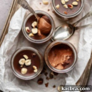 Nutella mousse cups on platter with spoons,.