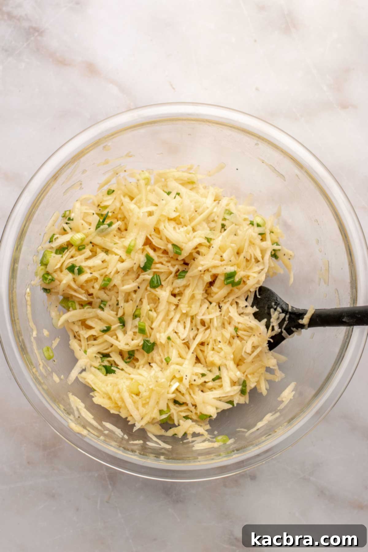 Shredded potatoes in a bowl.