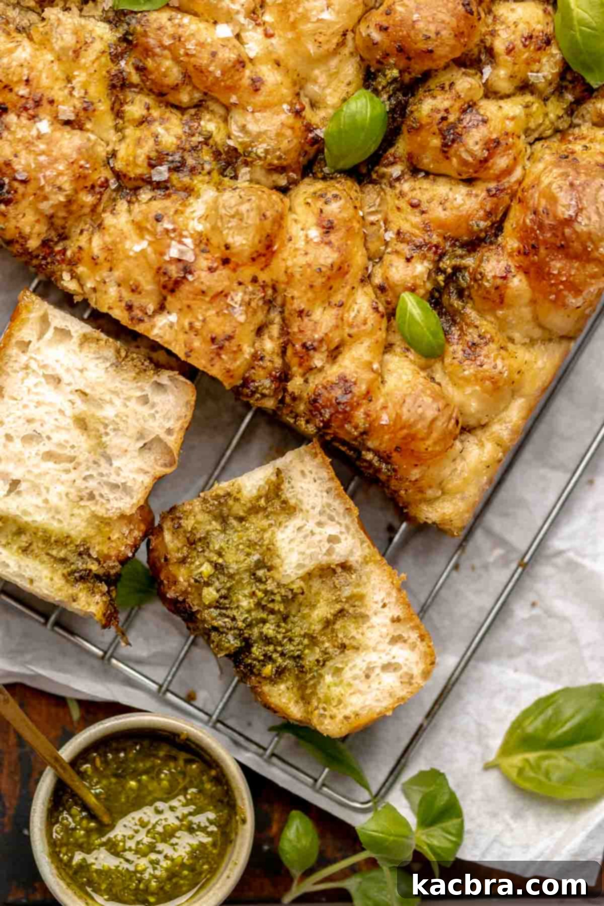 Aromatic Pesto Focaccia 2 Sliced pesto bread on a wire rack.
