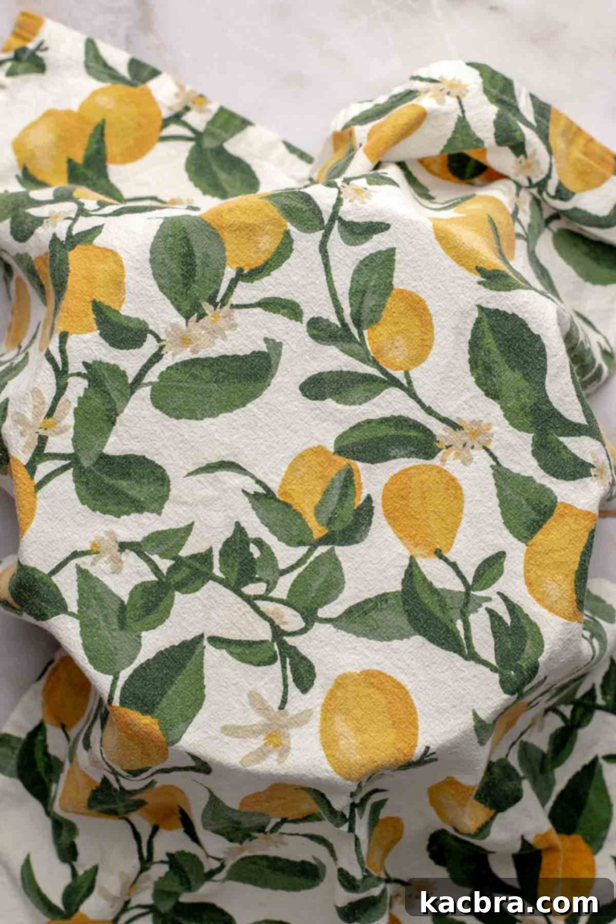 Aromatic Pesto Focaccia 9 Bowl covered with a dish towel.