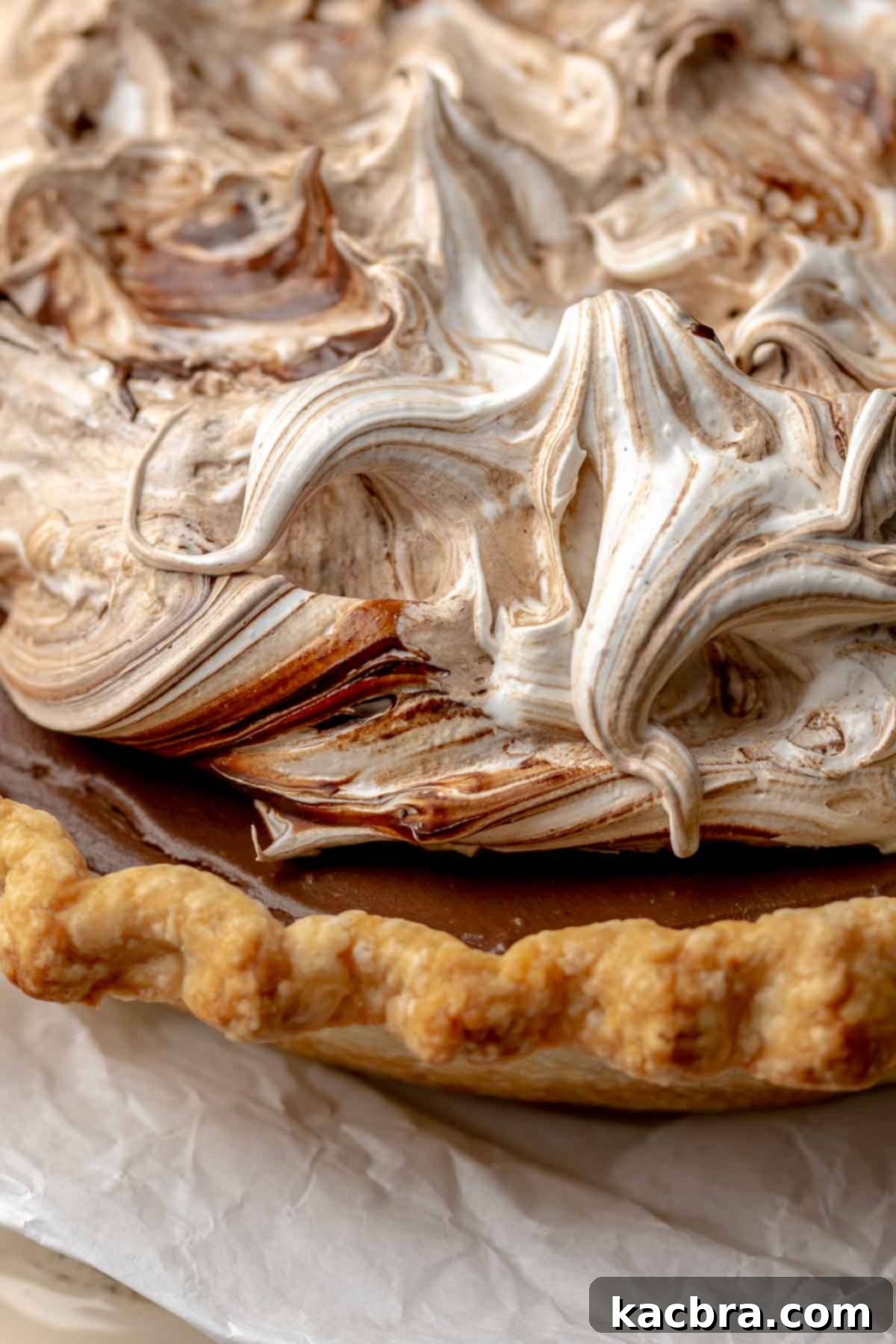 The finished chocolate meringue pie, beautifully topped with swirled meringue.