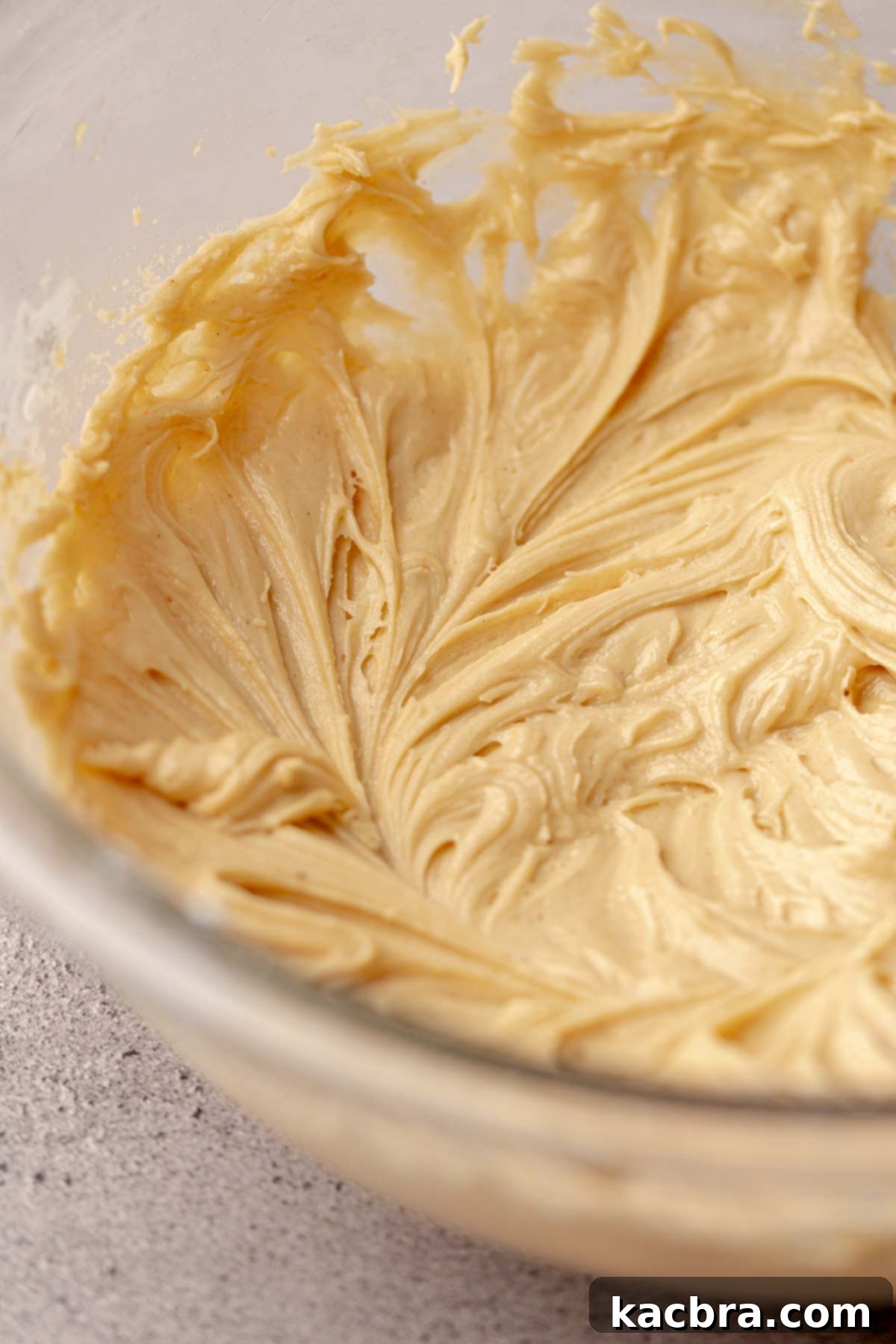 Finished peanut butter frosting in a bowl, showcasing its thick and spreadable consistency.