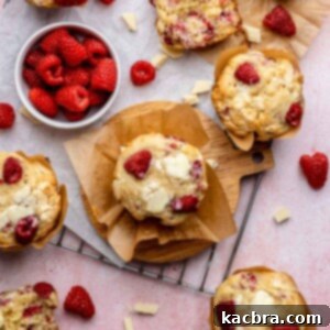 Raspberry white chocolate muffins scattered about.