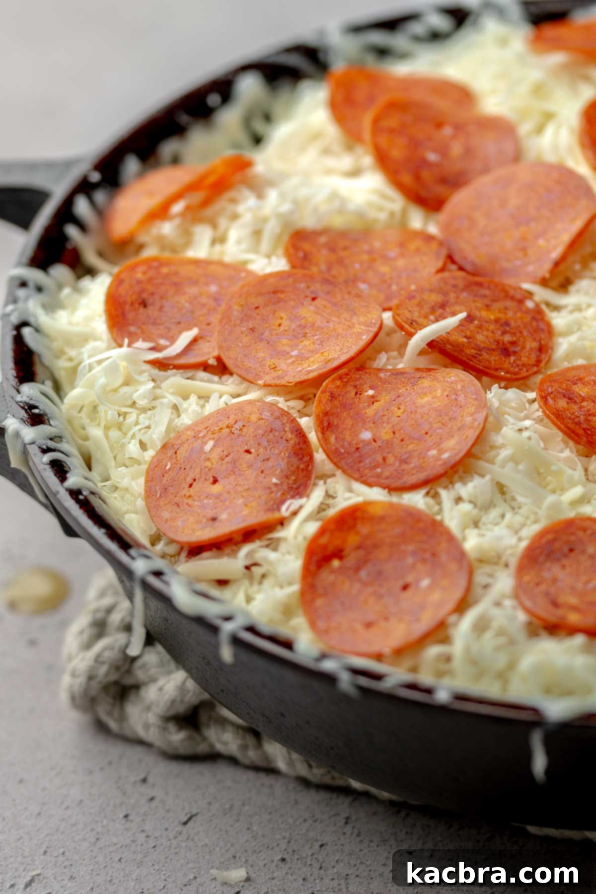 Pepperoni's on top of the cheese.