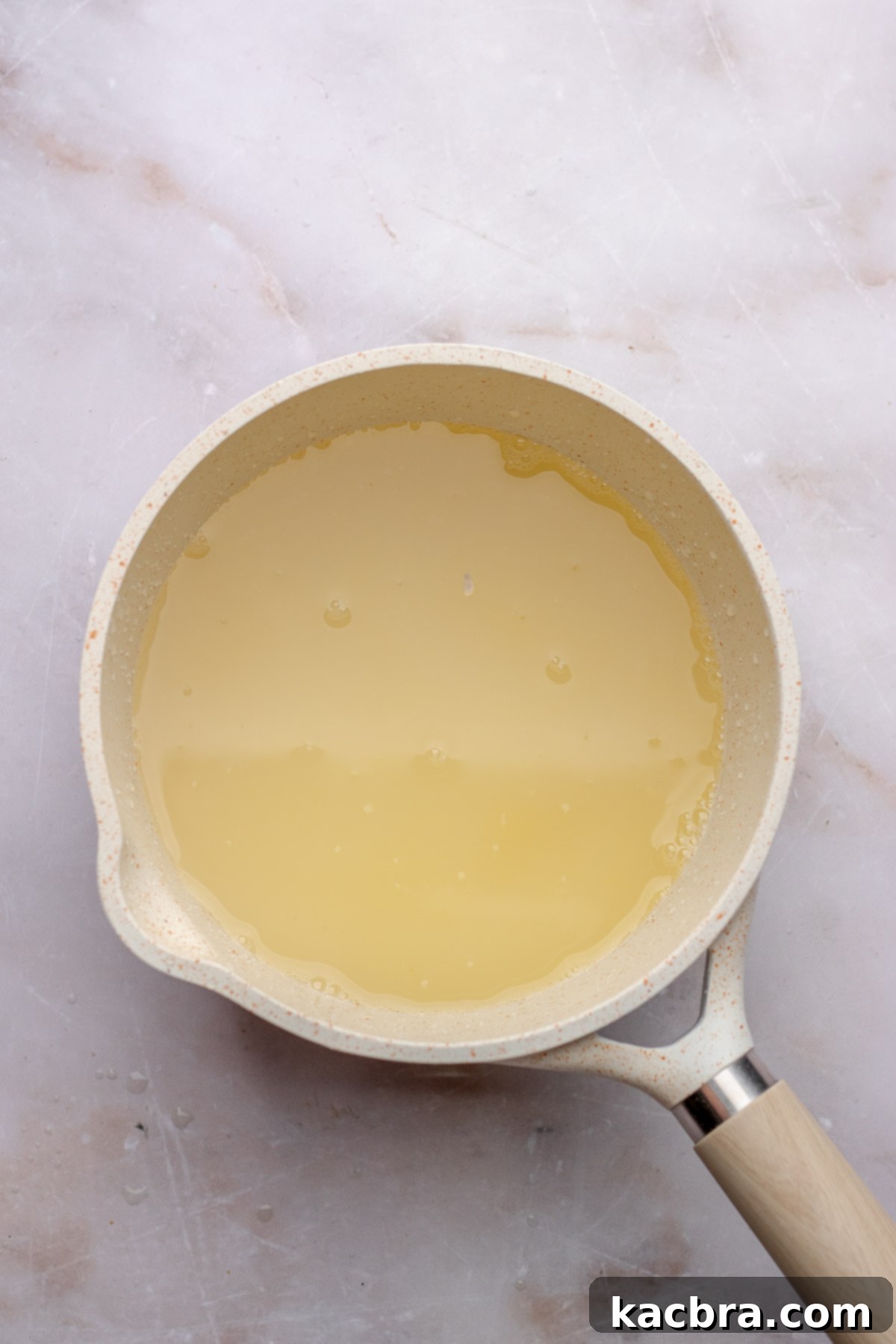 Lemon simple syrup in a pan.