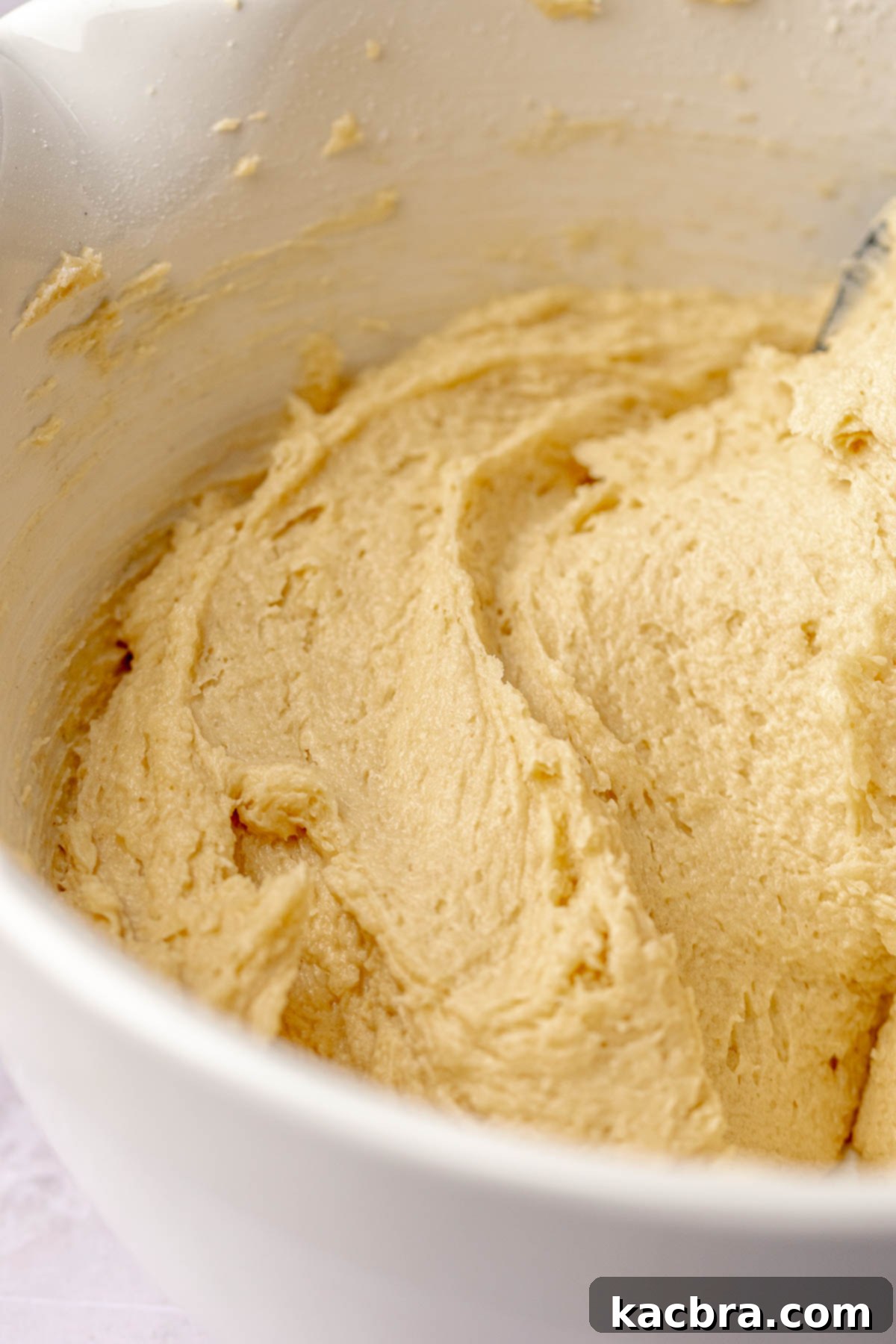 Smooth cake batter in a bowl, ready for the pan.