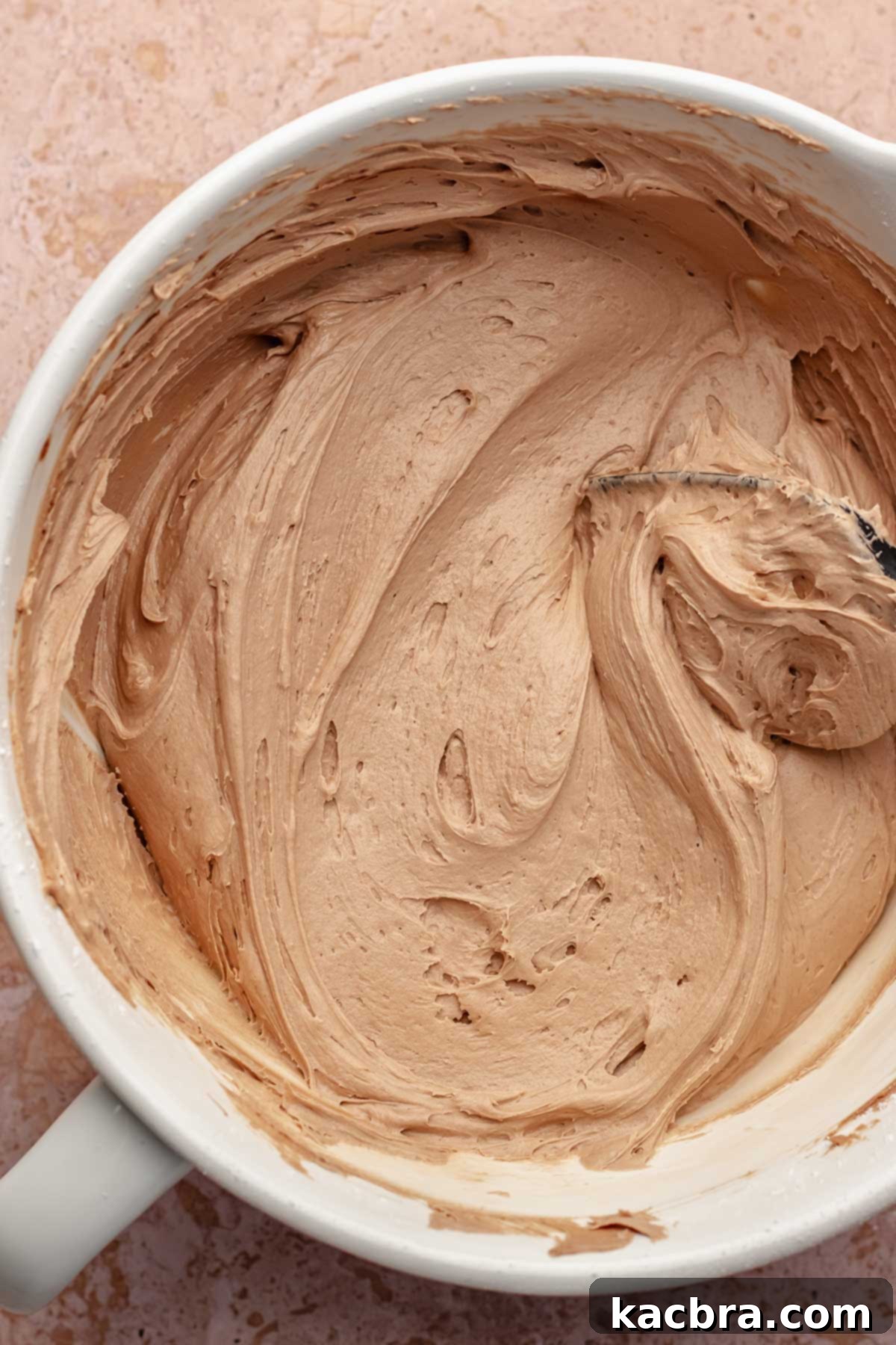 Fluffy nutella frosting in a bowl.