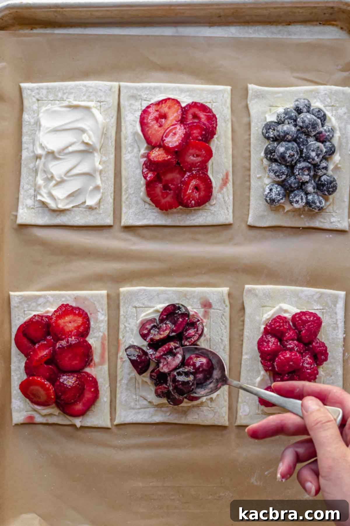 Add cherries and other fruit on top of the cream cheese.