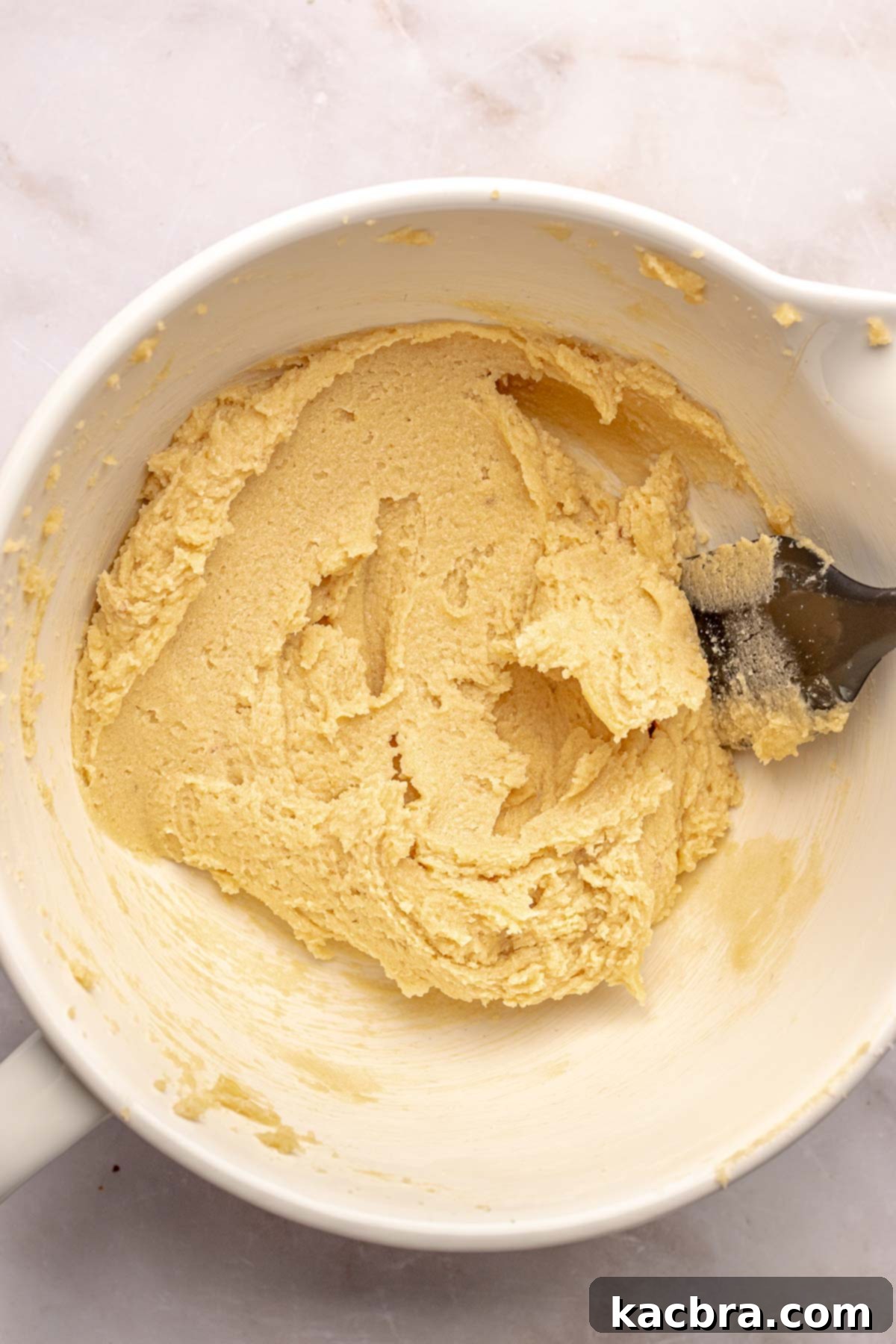 Warm Cornbread Cookies with Whipped Honey Butter 4 Creamed butter, honey, and sugars in a mixing bowl, ready for the next step.