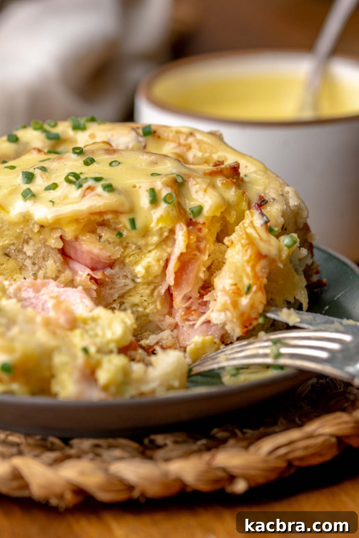 Fluffy Savory Rolls with Golden Hollandaise 3 Close-up of baked savory breakfast rolls showing the layered filling.