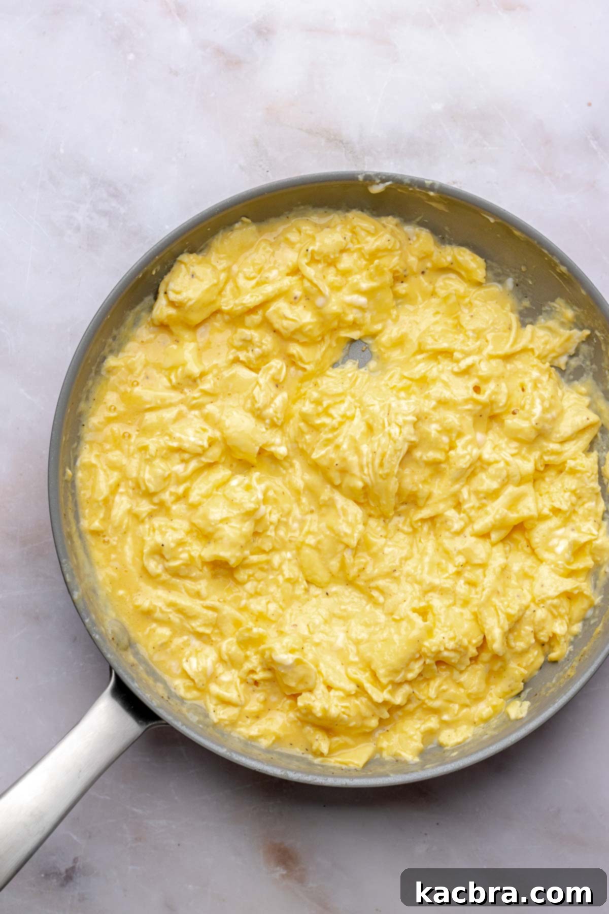 Fluffy Savory Rolls with Golden Hollandaise 9 Scrambled eggs cooked to a wet consistency in a non-stick pan.